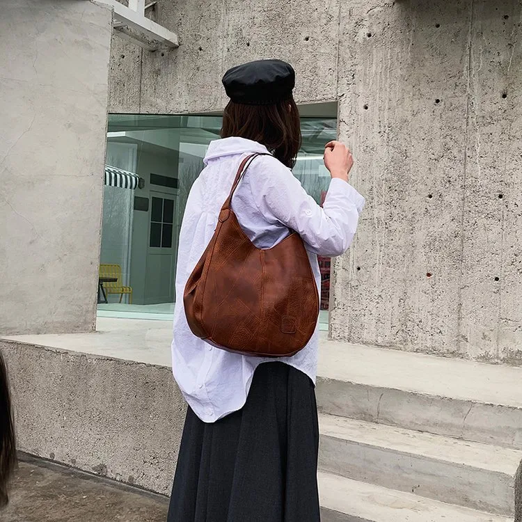 Solid Color Dumpling Shape Shoulder Bag for Women in PU Leather with Sewing Thread Detail, Perfect for Spring