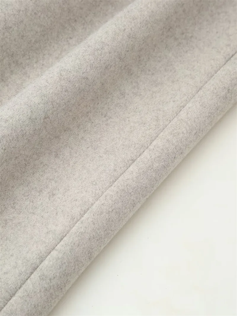 Elegant Woolen Coat for Women with Tie Placket, Polyester Fabric, Lapel Collar, Long Sleeve, and Pocket Detail